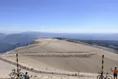 Riders at the top of Mont Ventoux, above the bald limestone dome.